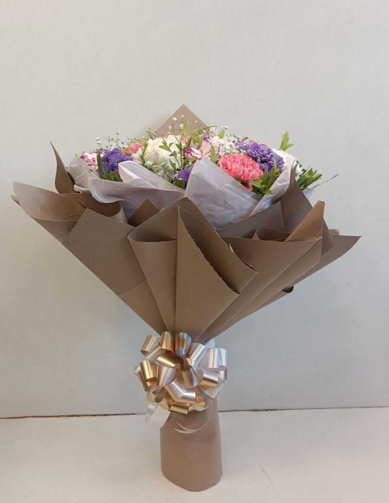 Bouquet of Carnations and Blue Daisies in Premium Wrap - Image 1