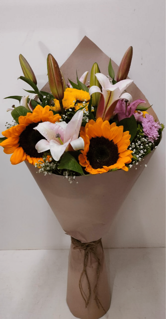Bouquet made with fragrant Oriental Lily, Sunflower and Spray/Button daisy - Image 1