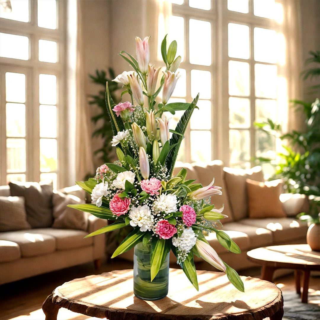 Oriental Lilies and Carnations Floral Arrangement in a Glass Vase