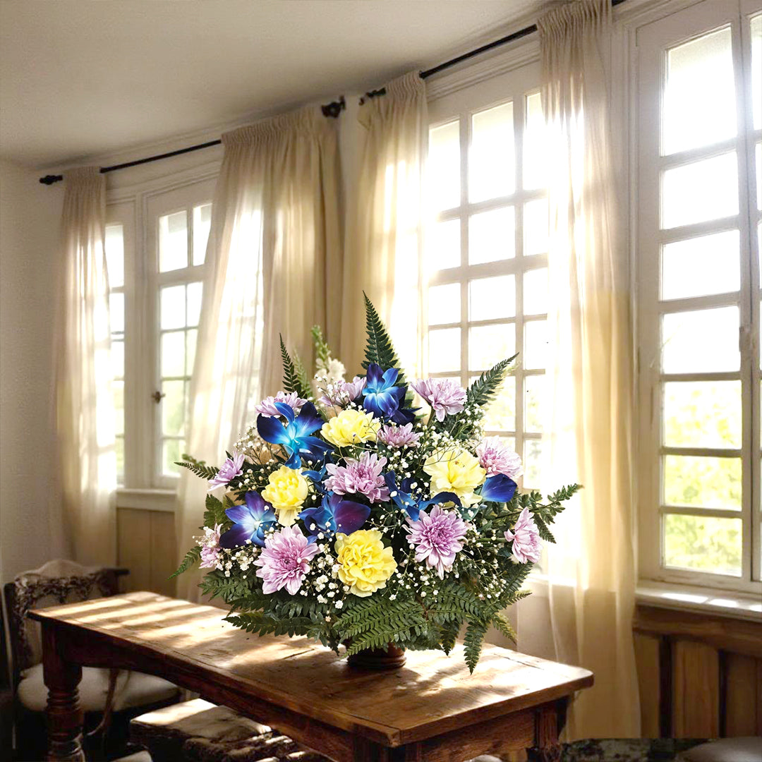 Floral Arrangement made with Spray Daisies, Carnations and Orchids in Glass Vase