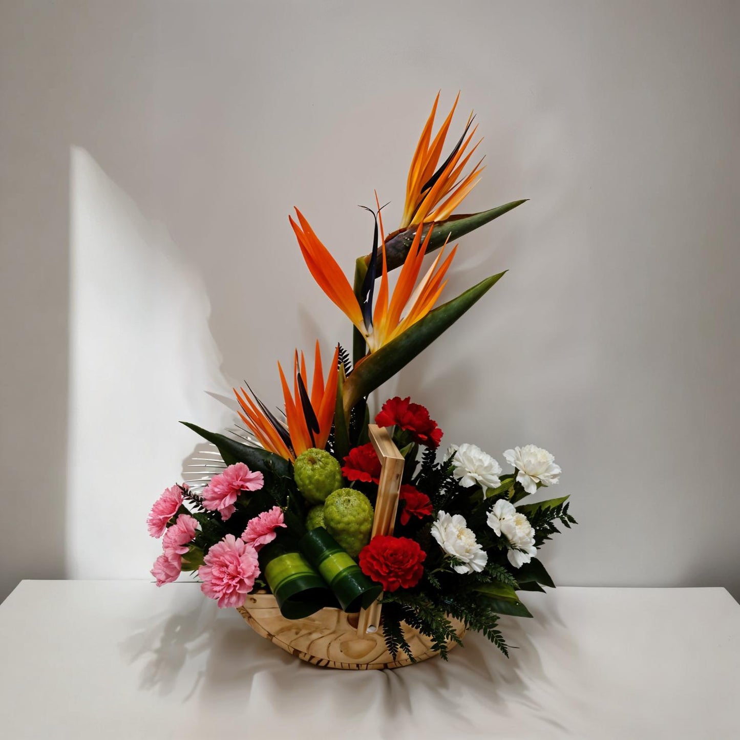Mixed Flower Arrangement in Wooden Boat