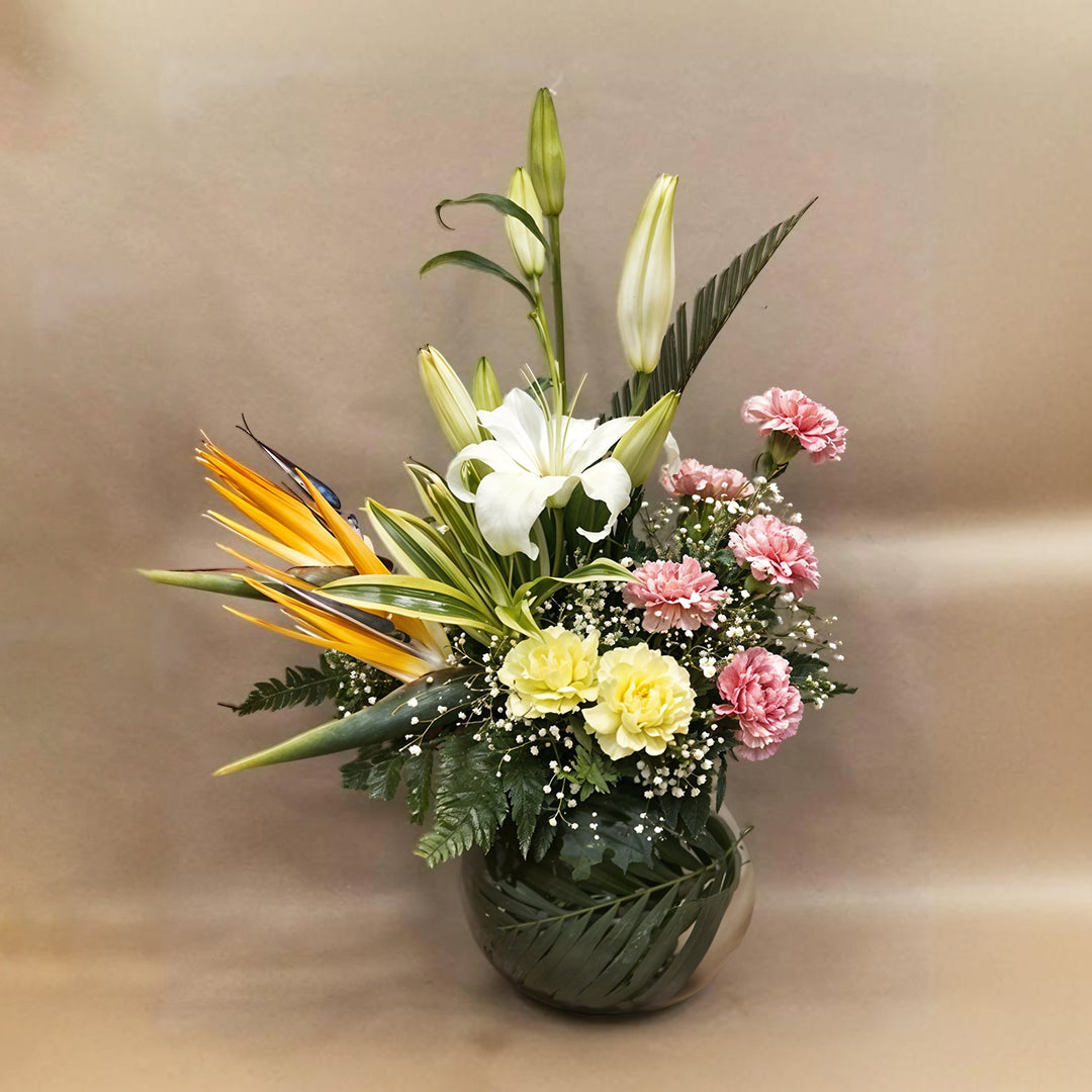 Floral Arrangement with Birds of Paradise, Oriental Lilies and Carnations in Fish Bowl