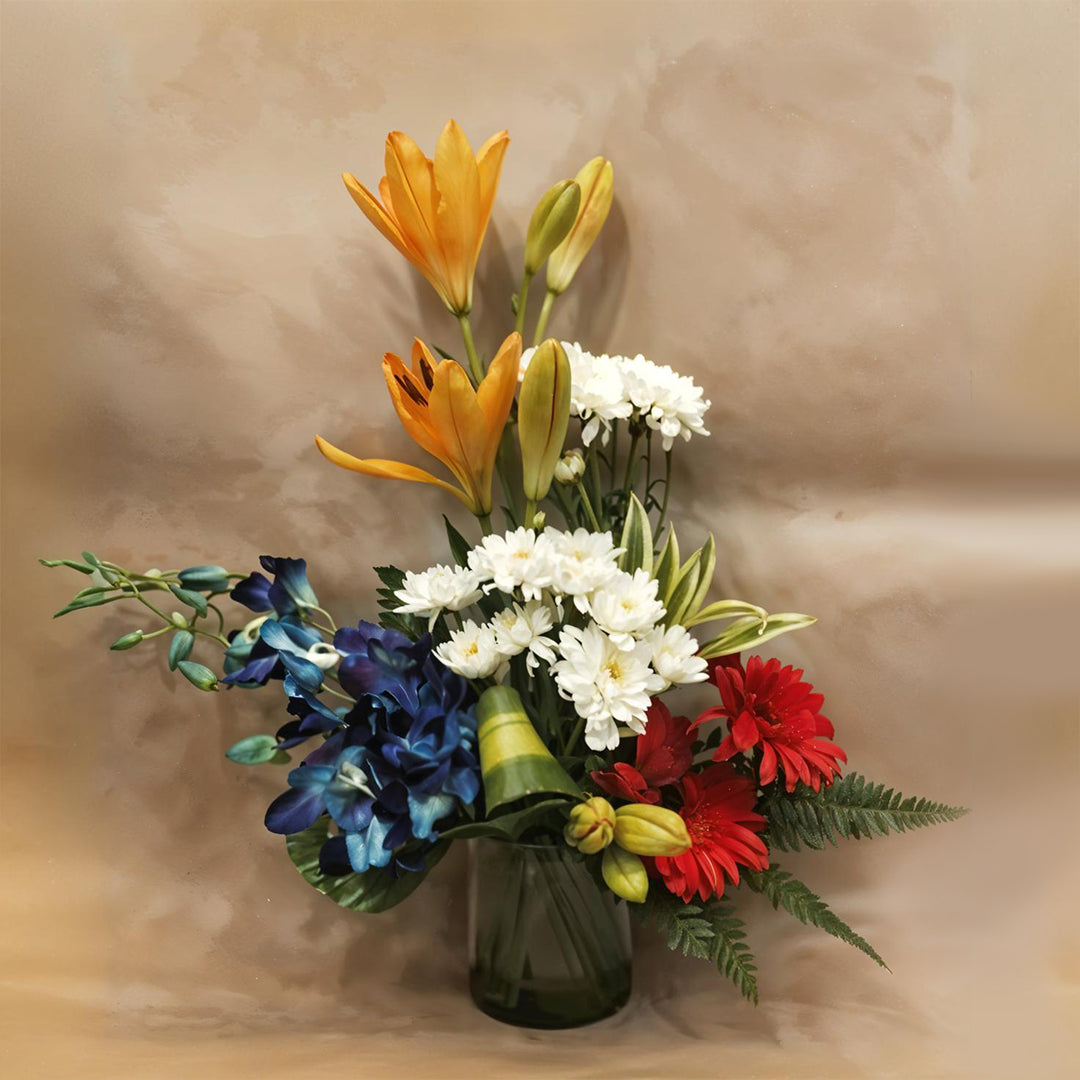 Floral Arrangement with Asiatic Lily, Spray Daisy, Gerbera and Orchids in Glass Vase