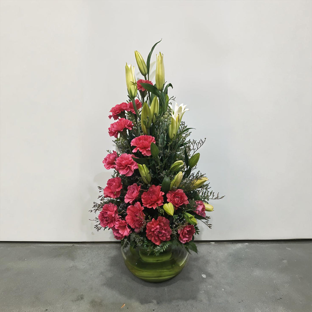 Fragrant Oriental Lily and Carnations arranged in Fish Bowl