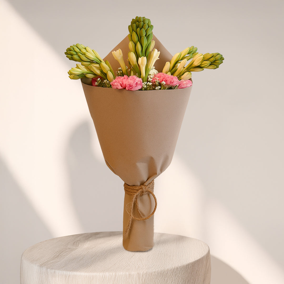 Fragrant Rajnigandha and Carnations in Brown Wrap