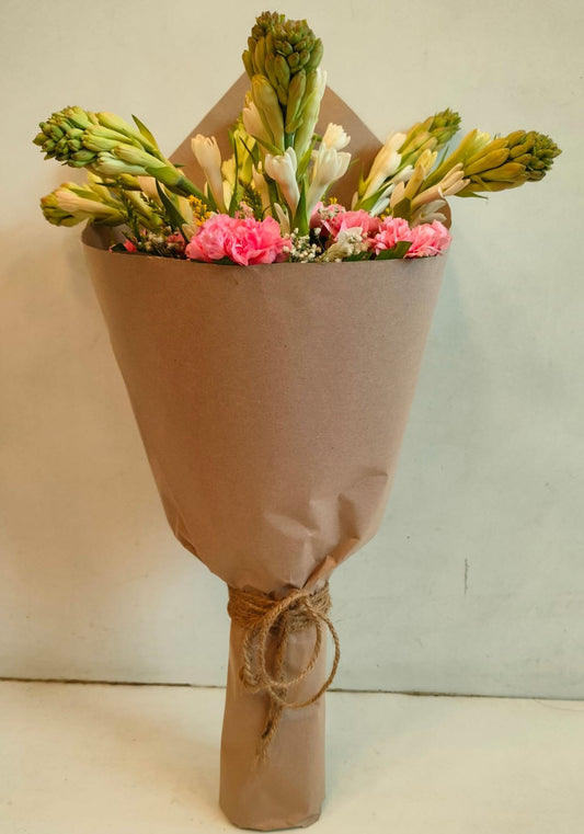 Fragrant Rajnigandha and Carnations in Brown Wrap - Image 1