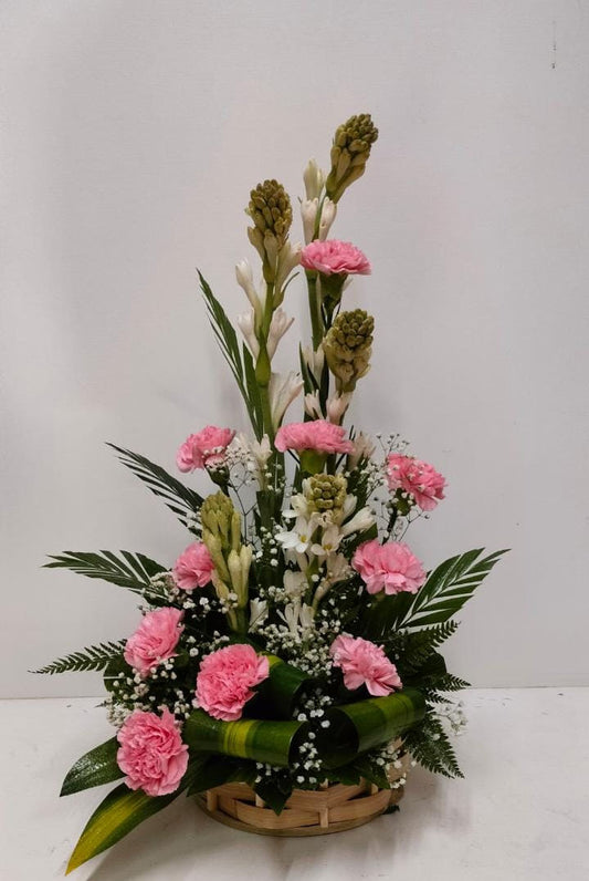 Flower arrangement made with Carnations and Rajnigandha - Image 1