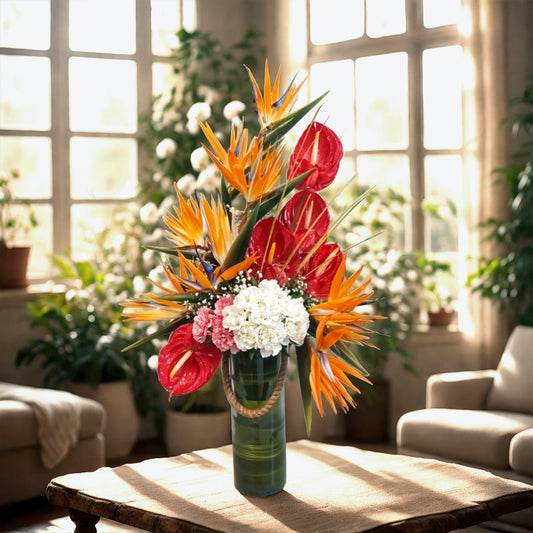 Floral Arrangement of Anthuriums, Birds of Paradise and Carnations in Glass Vase