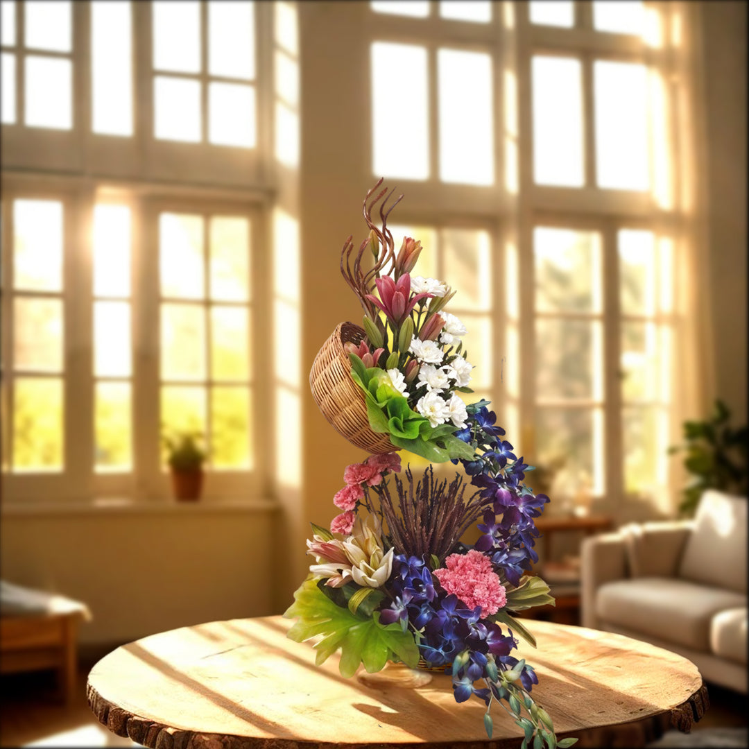 Floral Tall Arrangement with Oriental lilies, Asiatic Lilies, Carnations, Orchids in the basket