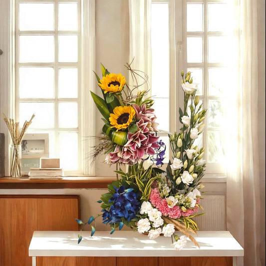 Floral Arrangement with Oriental Lilies, Sunflower, Eustoma , Carnations and Orchids in Basket