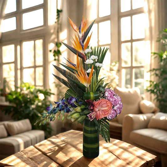 Flower Arrangement of birds of Paradise, Orchids, Oriental Lilies, Anthurium & Carnations in Glass Vase