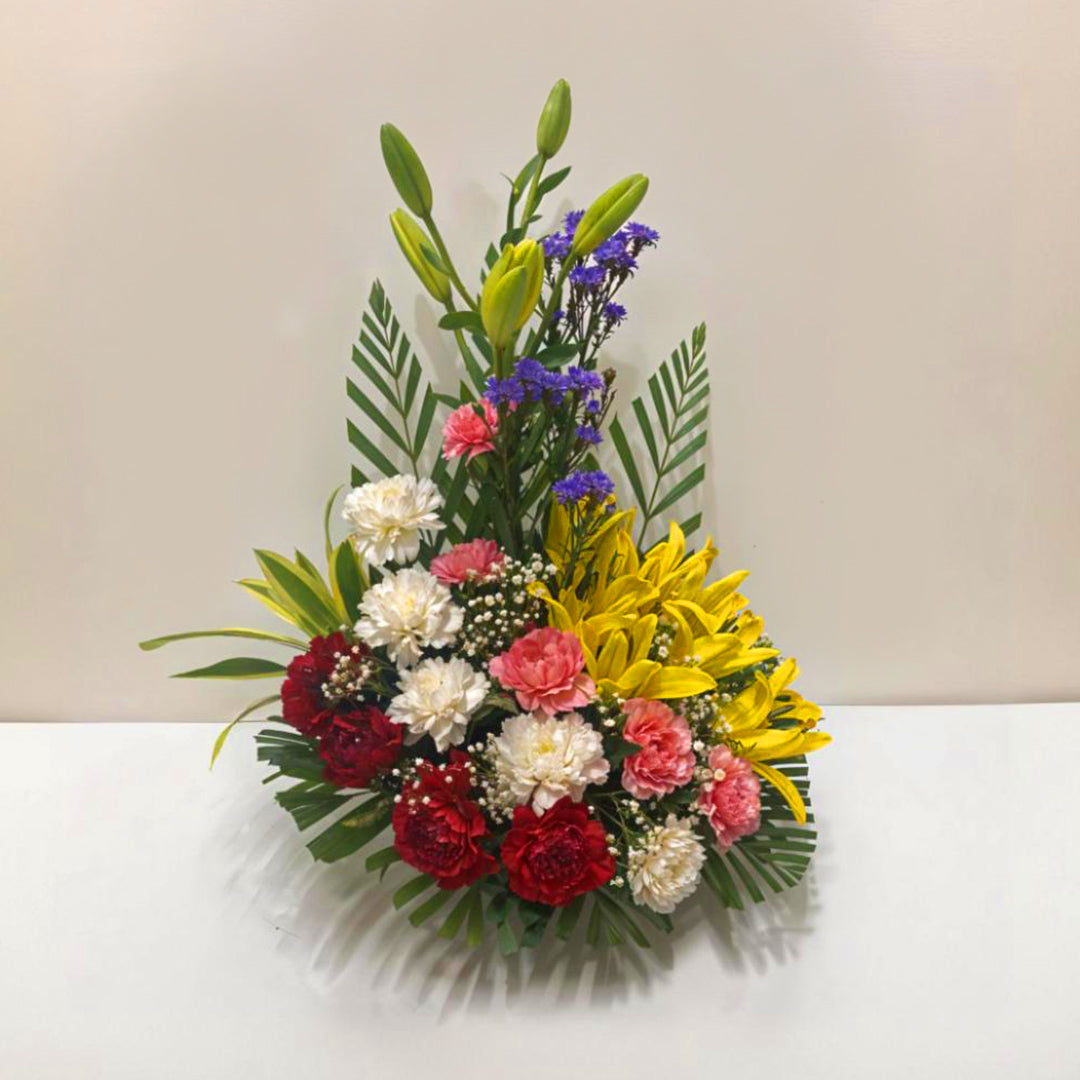 Flower Arrangement with Asiatic Lily and Carnations in Basket